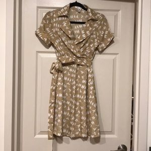 Yellow-gold wrap dress with bird print